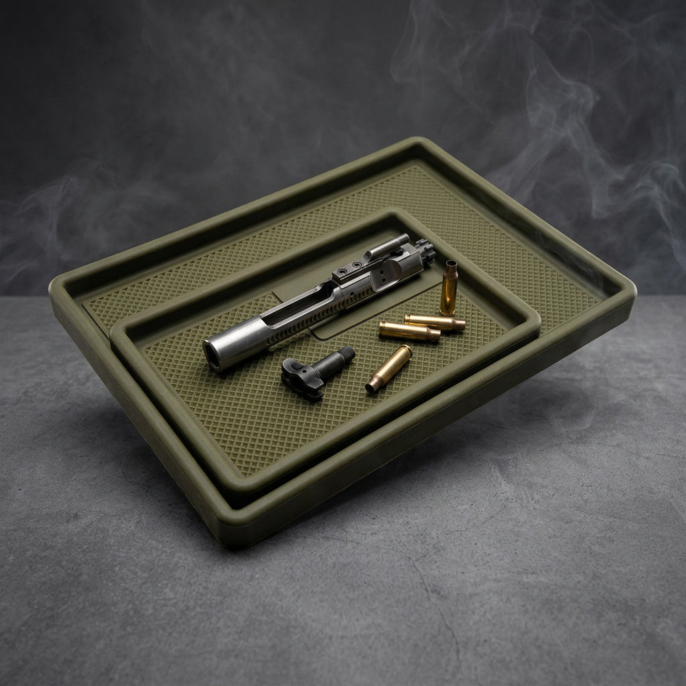 TacticalTray gun cleaning tray set holding a bolt and ammunition on a workbench