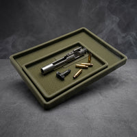 TacticalTray gun cleaning tray set holding a bolt and ammunition on a workbench