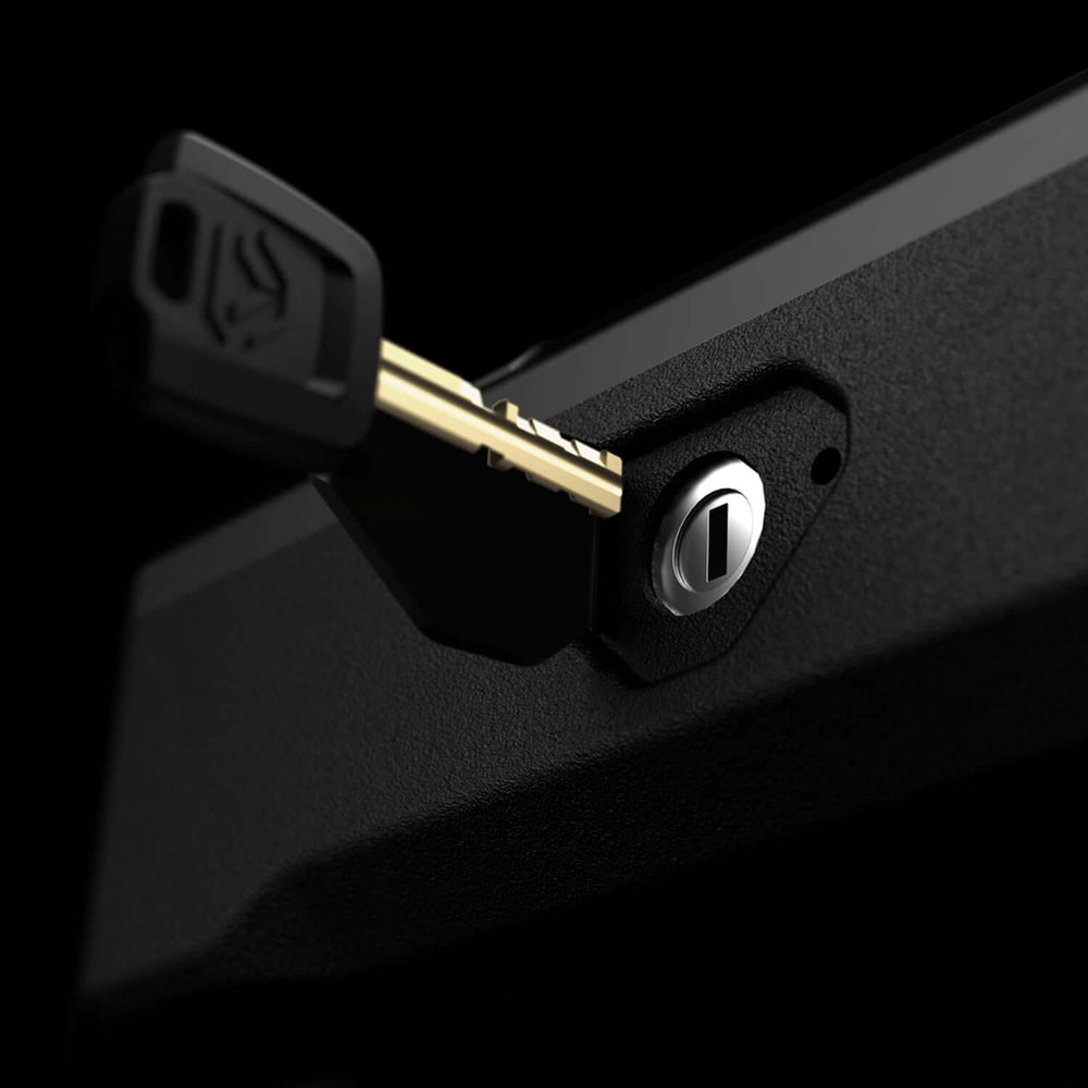 Vaultek 10 Series Essential Biometric keyhole close-up with key for secure access to the safe.