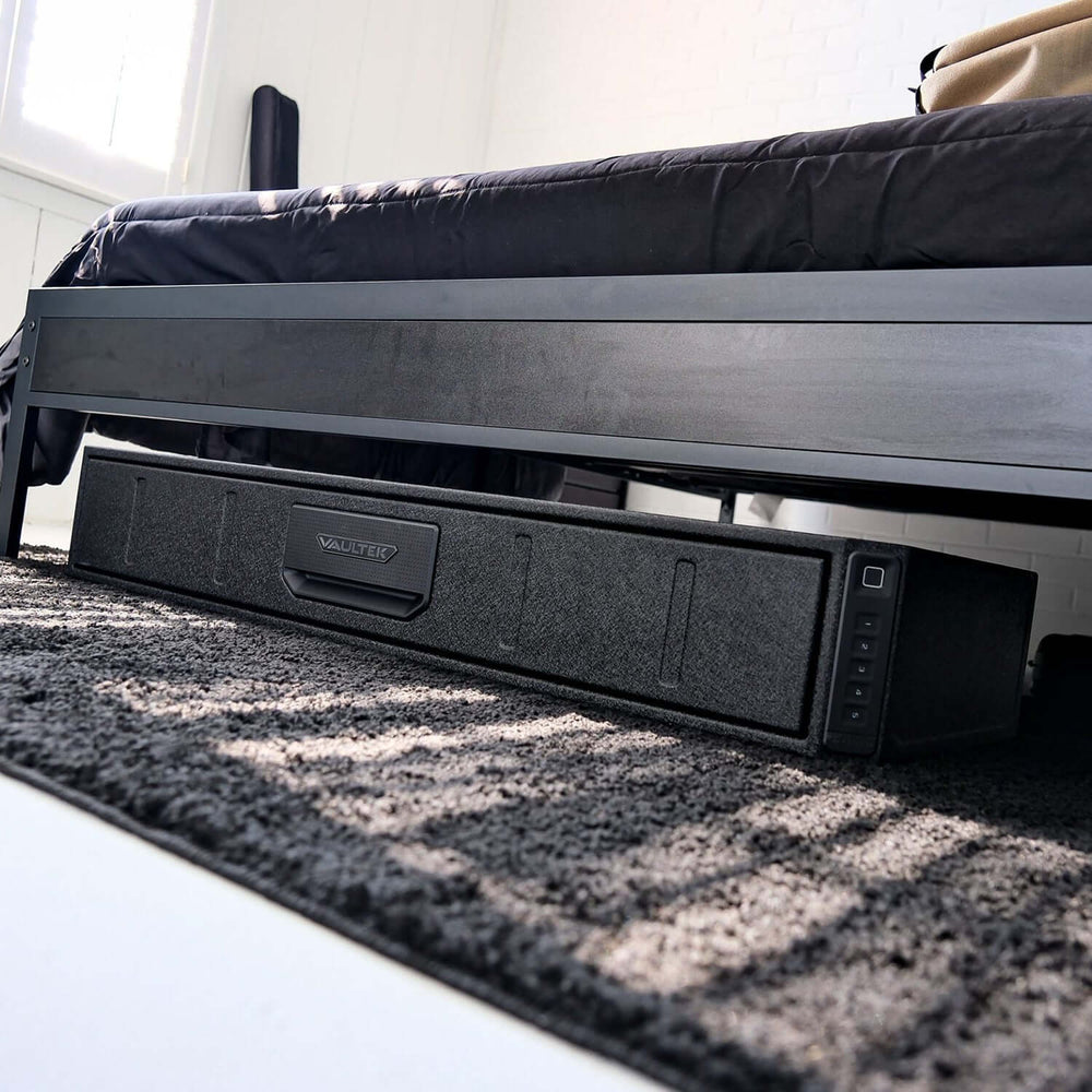 Vaultek RS Slider ViSN Biometric Safe positioned under a bed for discreet storage.