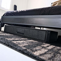 Vaultek RS Slider ViSN Biometric Safe positioned under a bed for discreet storage.