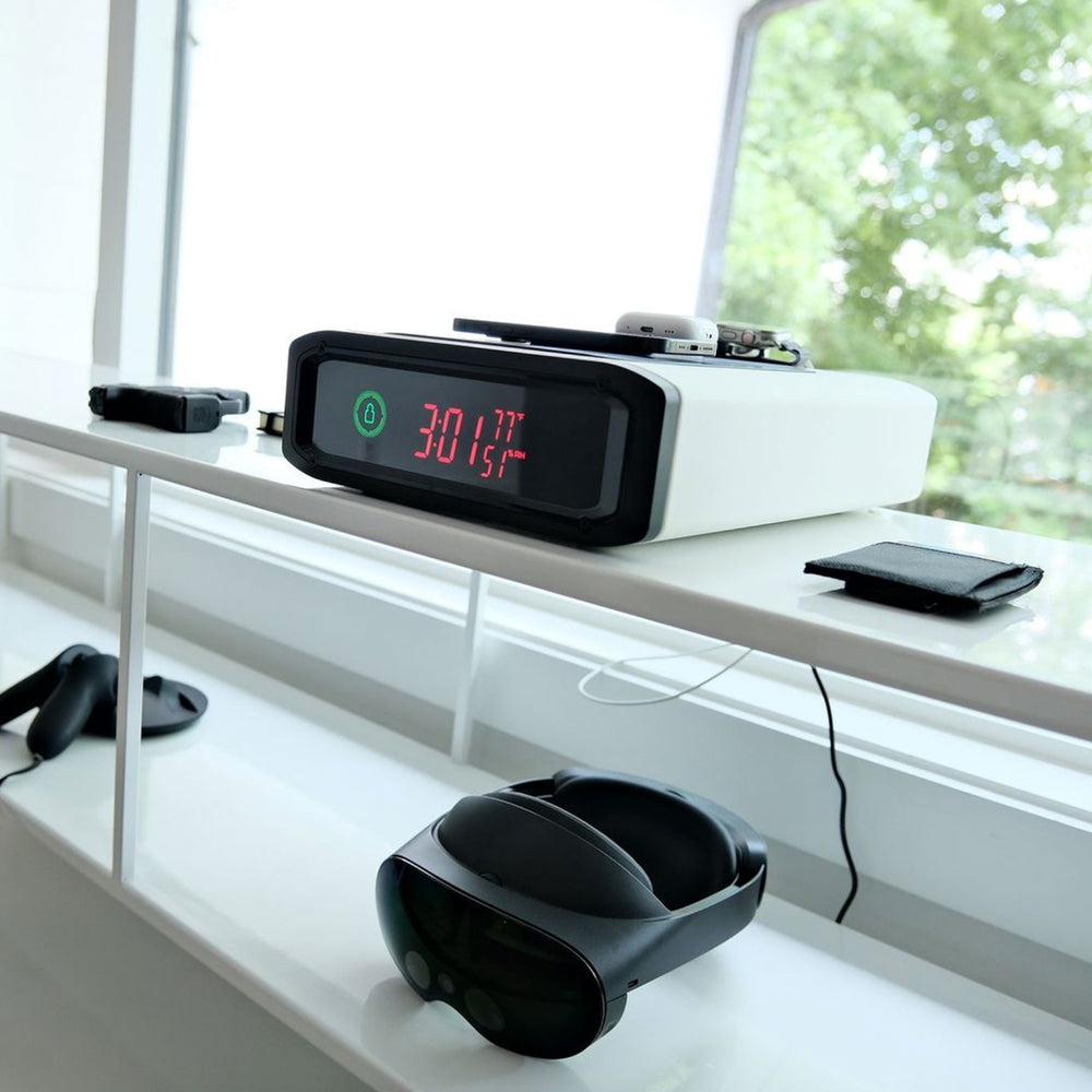 Vaultek DS5i Smart Station ViSN Biometric secure safe with wireless charging on a desk.
