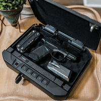 Vaultek 20 Series Biometric safe with handgun and accessories inside, designed for quick access and security.