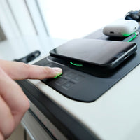 User activating the Vaultek DS5i Smart Station ViSN Biometric with a smartphone on top.