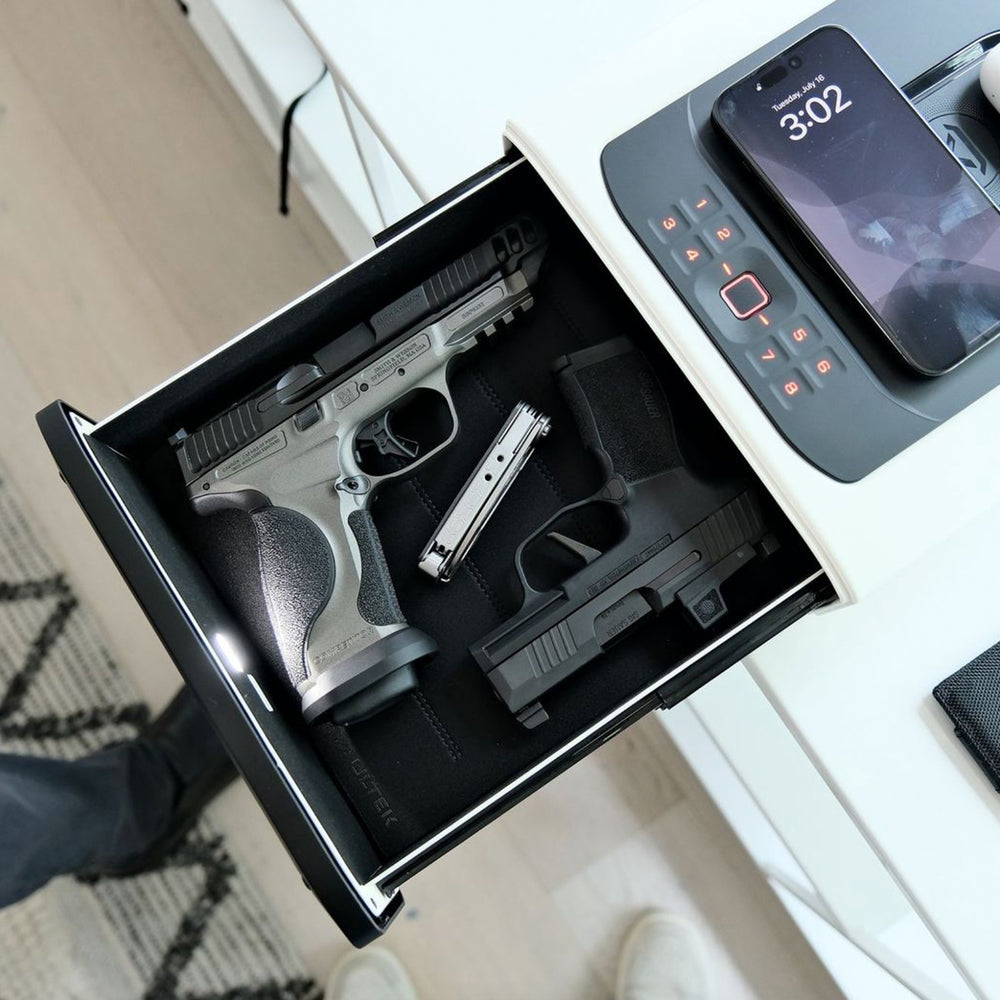 Vaultek DS5i Smart Station ViSN Biometric secure storage with two pistols and a smartphone.