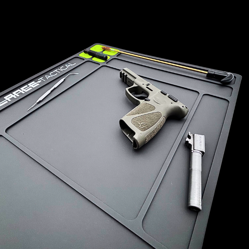 TacticalMat - 2 Mat Bundle featuring a gun and accessories on a clean workspace