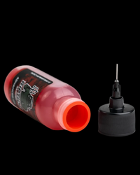 Riptide Armory Advanced Gun Oil with Graphene bottle and applicator, perfect for firearm maintenance.